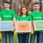 environment-volunteer-concept-with-persons-holding-boxes-donations